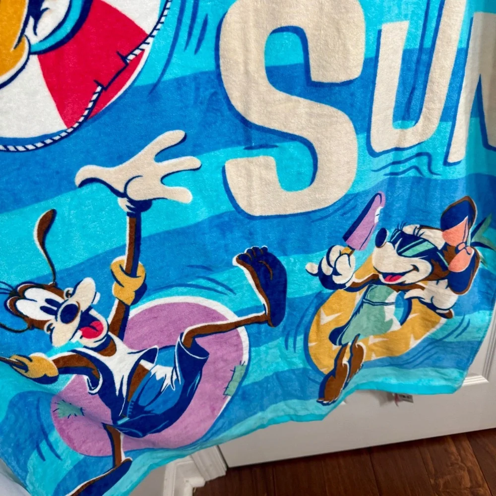 NWT. Disney beach towel featuring Mickey Mouse and others. “FUN IN THE SUN